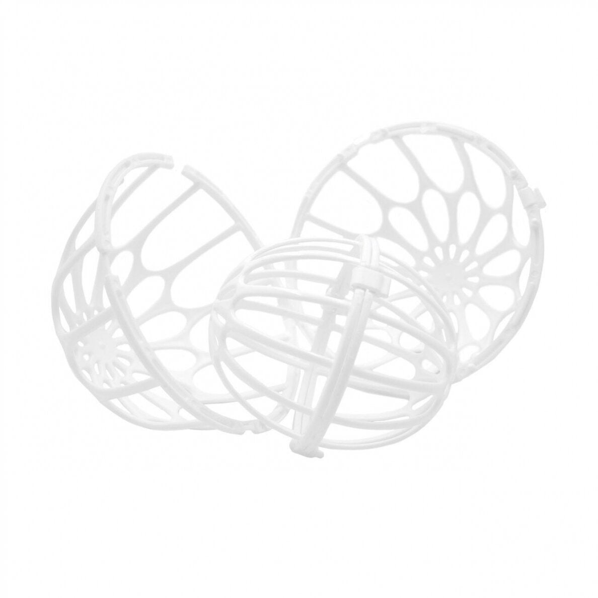 Tre hvide, kugleformede Julimex-vaskekugler i plast med åbne gittermønstre overlapper hinanden på en hvid baggrund. Hver har buede, krydsende bånd, der giver et burlignende udseende og fungerer som bh-beskytter.