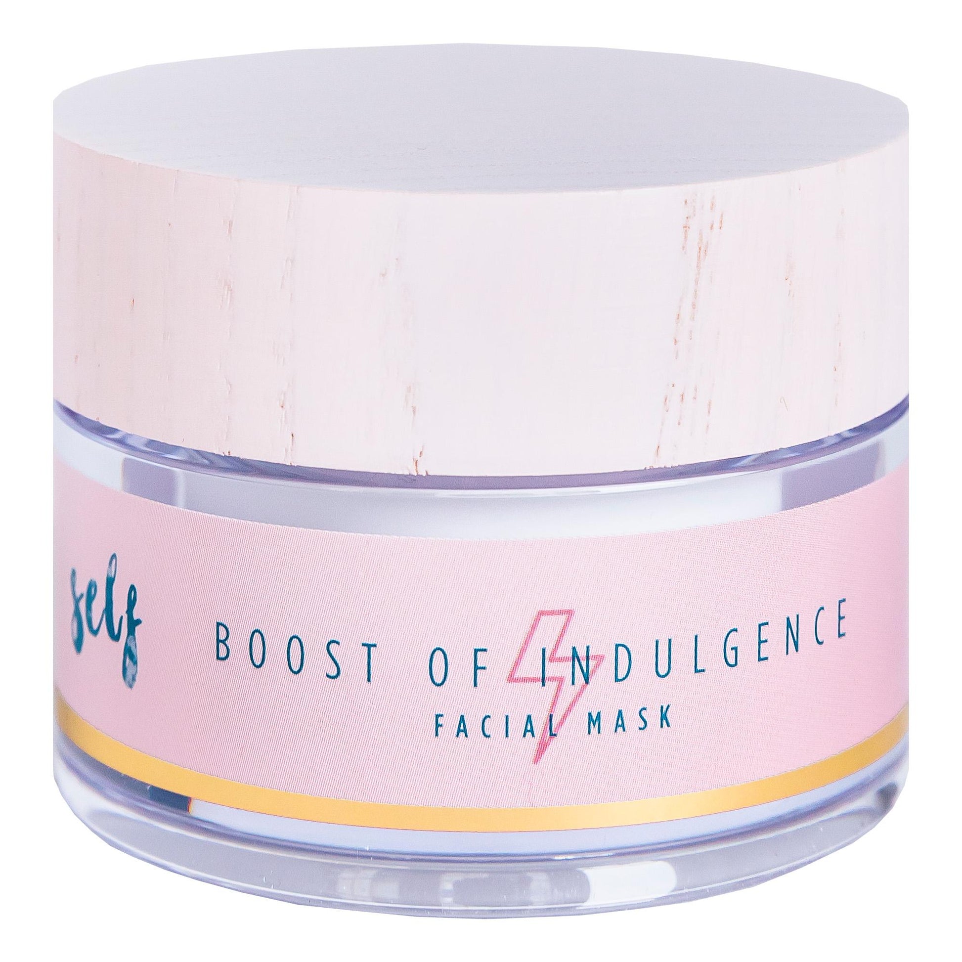 En rund krukke med Natural Self Boost of Indulgence Facial Mask, en fugtgivende og anti-aging ansigtsmaske, med en lyserød etiket, guldstribe, blå og guld tekst, stiliseret lyn over "Indulgence" og hvidt træstruktureret låg.